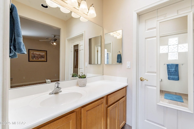 bathroom featuring a ceiling fan and vanity