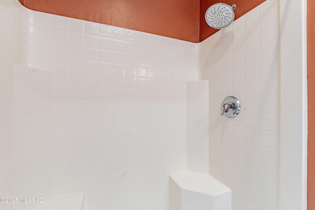 full bath featuring a tile shower