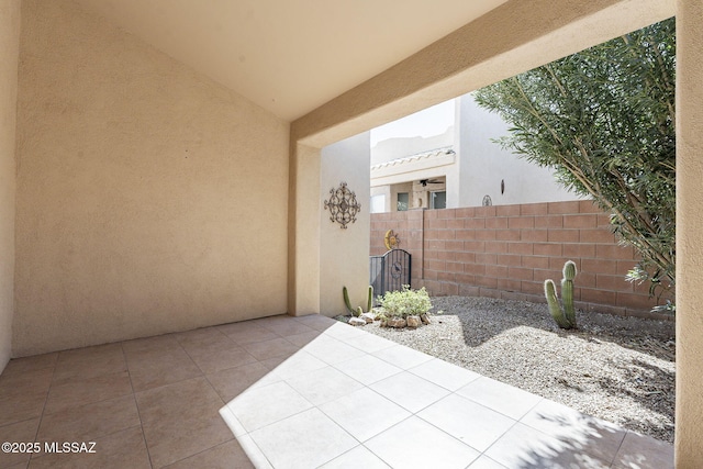 view of patio featuring fence