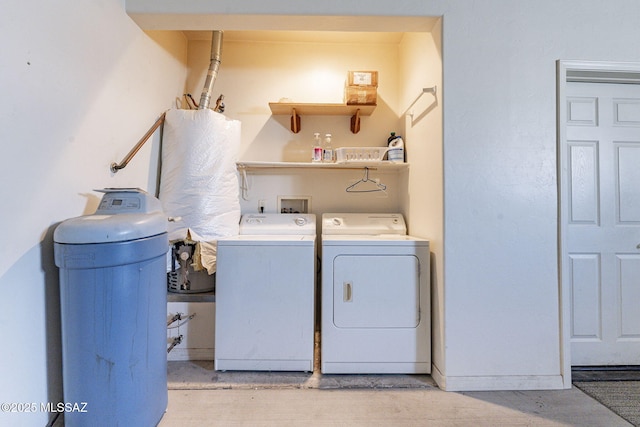 clothes washing area with laundry area and washing machine and clothes dryer