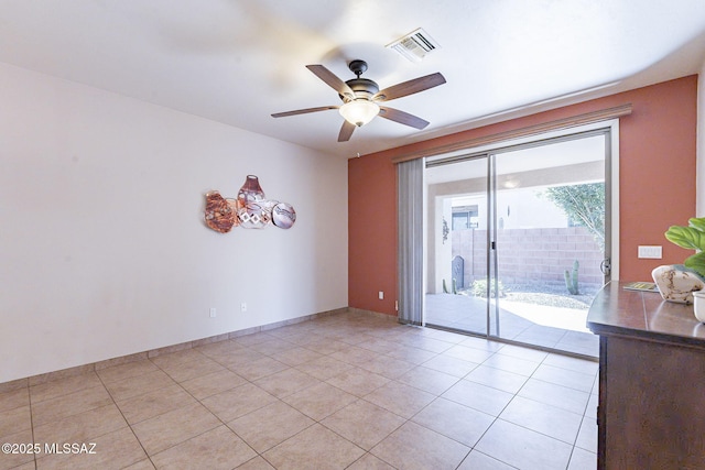 unfurnished room with light tile patterned flooring, visible vents, and a ceiling fan