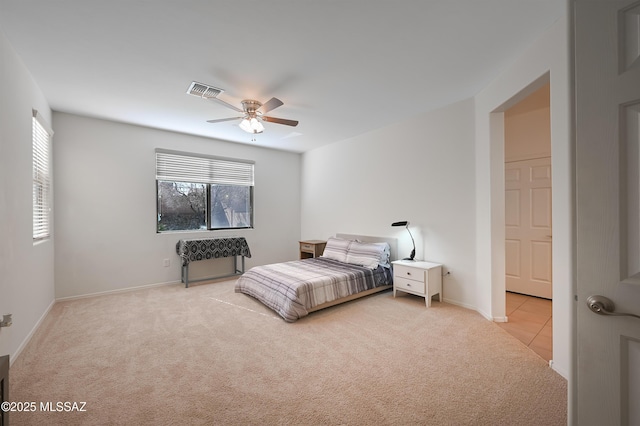 bedroom featuring ceiling fan and light colored carpet