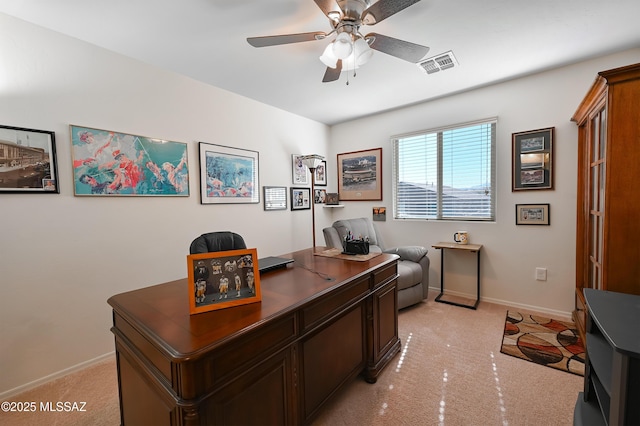 carpeted home office with ceiling fan