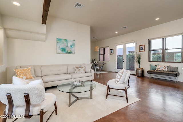 living room with concrete flooring