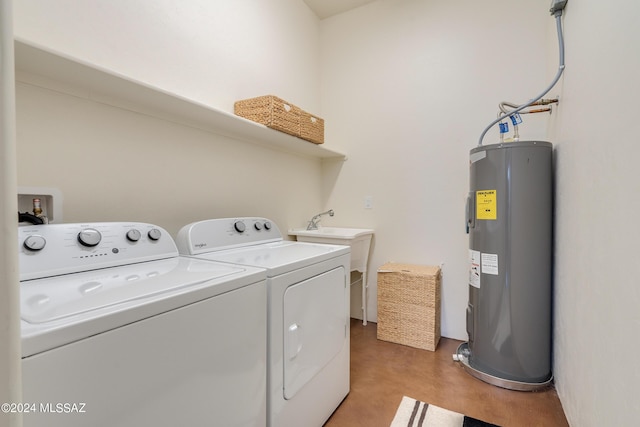 washroom featuring independent washer and dryer, sink, and water heater