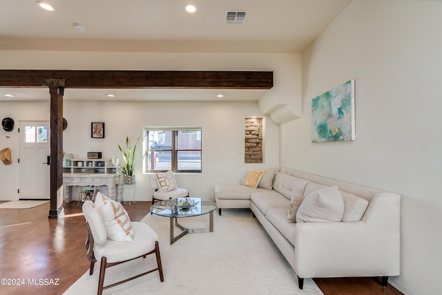 living room featuring beam ceiling