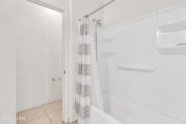 bathroom featuring tile patterned flooring and shower / bath combo