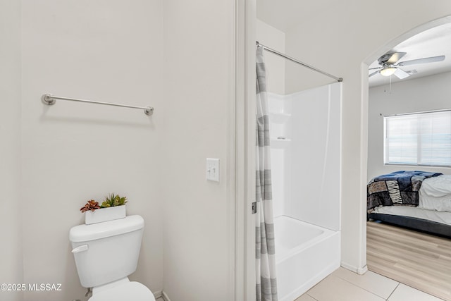 bathroom featuring tile patterned floors, toilet, and ceiling fan