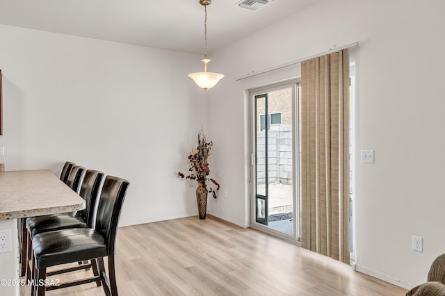 dining space featuring light hardwood / wood-style floors