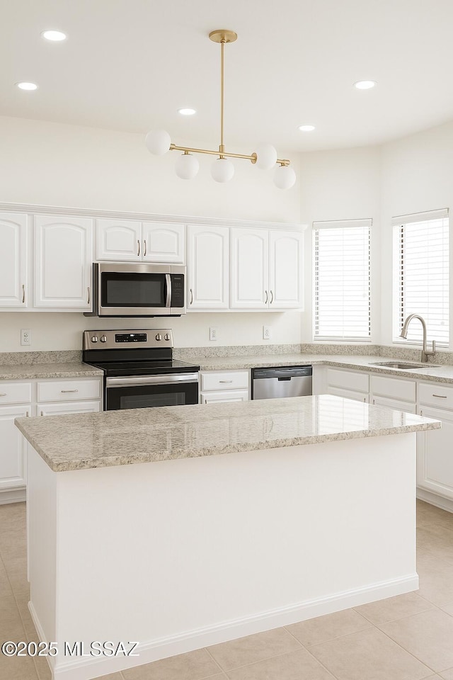 533 N Kino Springs Dr, Nogales, AZ 85621 - kitchen with appliances with stainless steel finishes, a sink, recessed lighting, white cabinetry, and light tile patterned floors