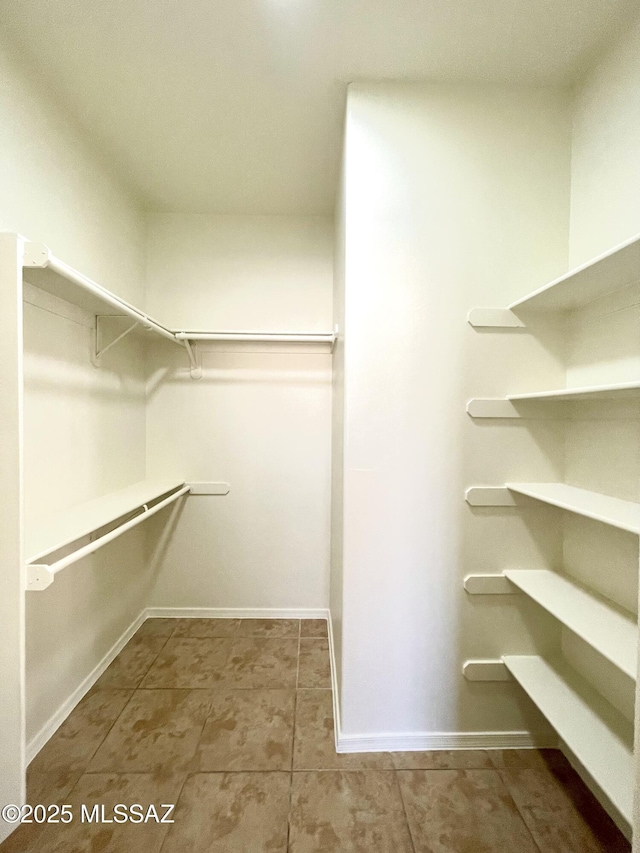 533 N Kino Springs Dr, Nogales, AZ 85621 - spacious closet featuring tile patterned floors