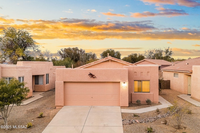 southwest-style home with a garage