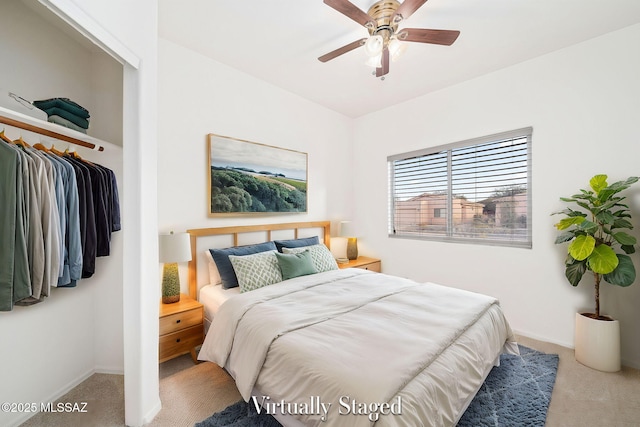carpeted bedroom featuring ceiling fan