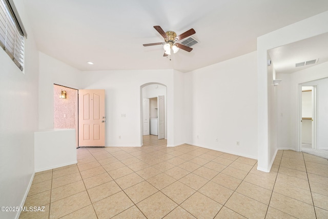 tiled empty room with ceiling fan