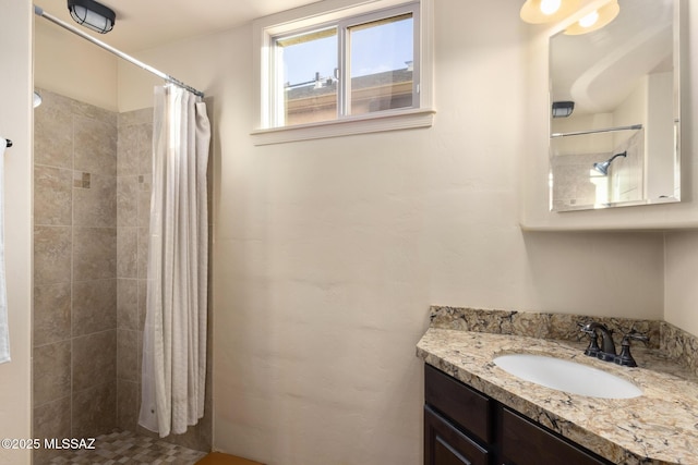 bathroom with a shower with curtain and vanity