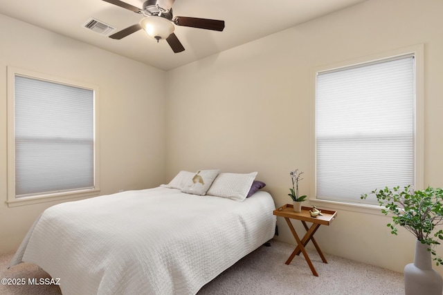 bedroom with ceiling fan and carpet