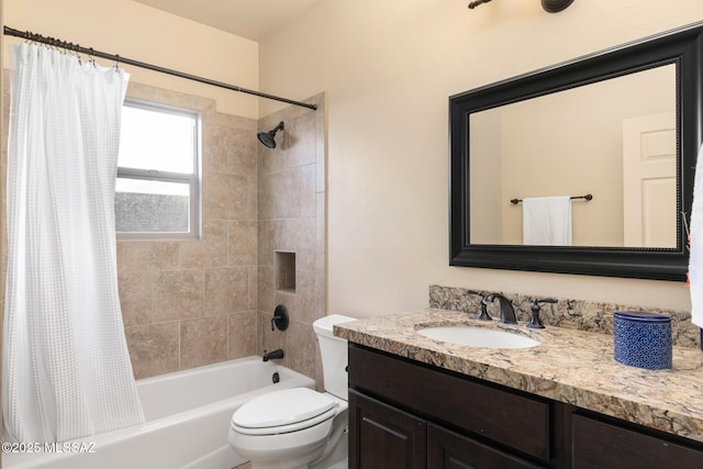 full bathroom featuring vanity, shower / bath combination with curtain, and toilet