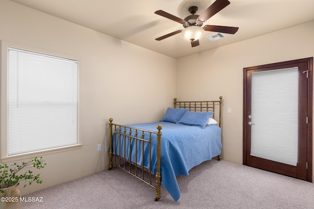 bedroom with ceiling fan and light colored carpet