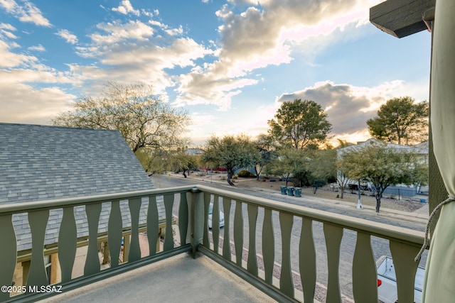 view of balcony at dusk