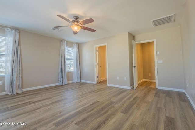 unfurnished bedroom featuring hardwood / wood-style flooring and ceiling fan