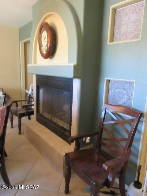 living area with tile patterned floors