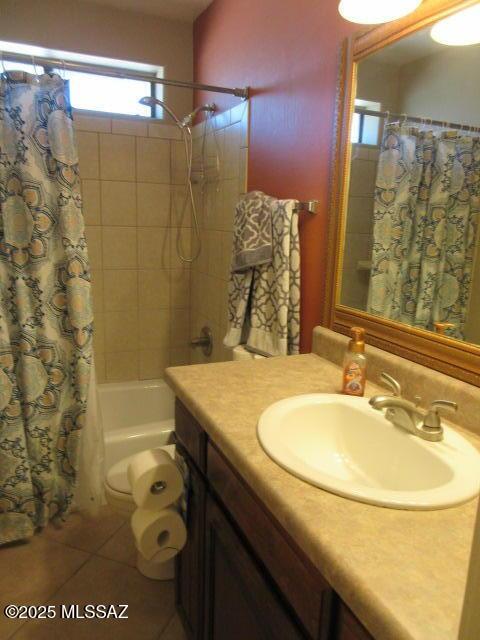 bathroom with tile patterned floors, shower / tub combo, and vanity