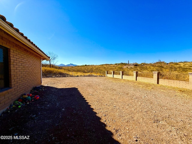 view of yard with a mountain view