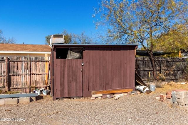 view of shed featuring a fenced backyard