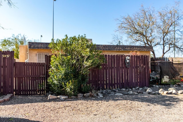 view of gate featuring fence