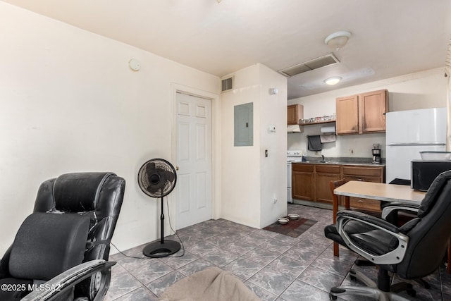 home office with electric panel, visible vents, and attic access