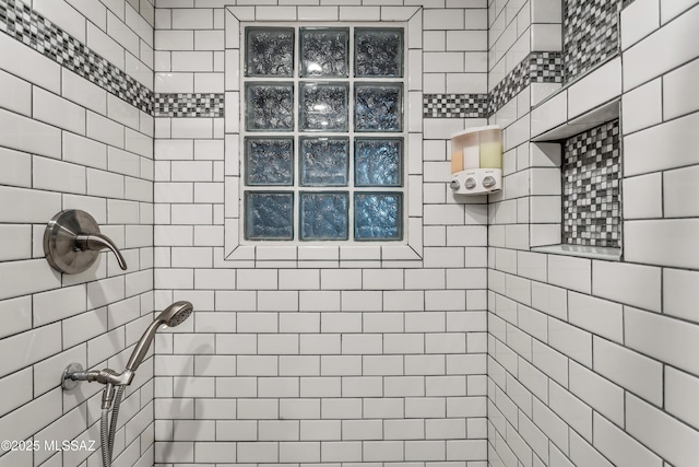 full bath featuring tiled shower
