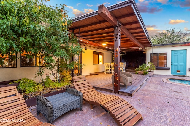 view of patio / terrace featuring outdoor dining area and a wooden deck