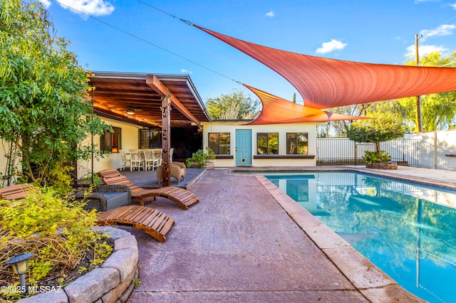view of pool featuring a patio area, a fenced in pool, and fence