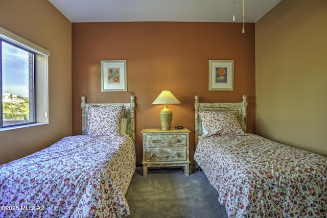 bedroom with dark colored carpet