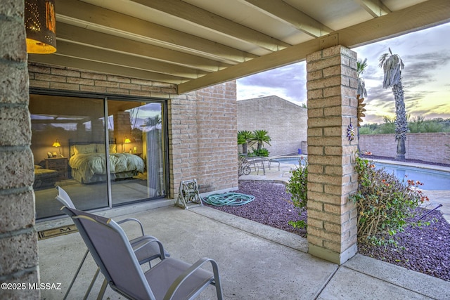 view of patio terrace at dusk