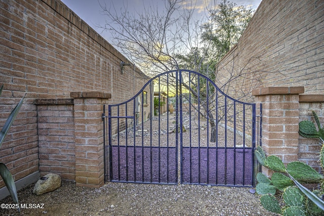 view of gate at dusk