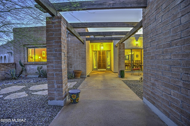 property entrance featuring a patio