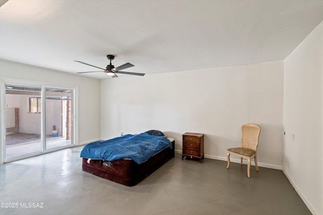 bedroom featuring ceiling fan, access to exterior, and concrete floors