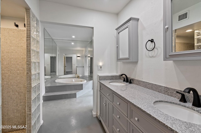 bathroom with vanity, concrete floors, and walk in shower