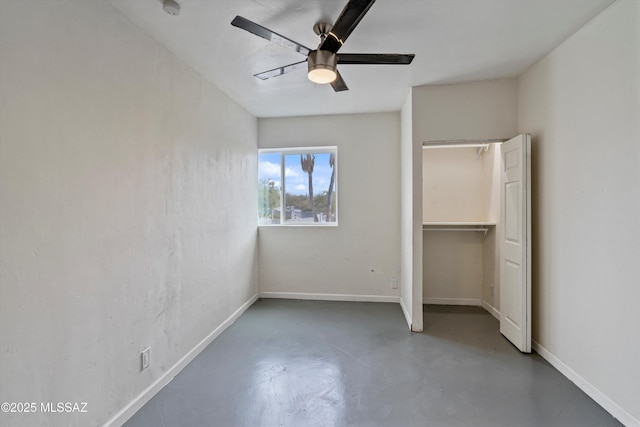 unfurnished bedroom with concrete floors and ceiling fan