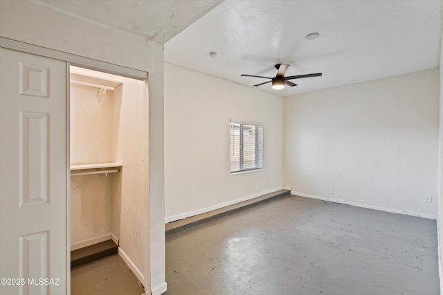 unfurnished bedroom with concrete floors, a closet, and ceiling fan