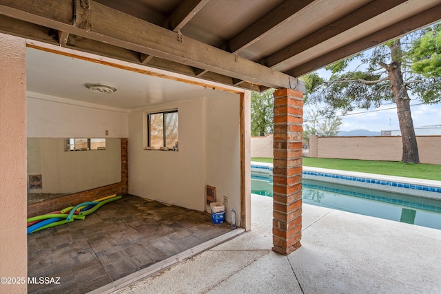 view of patio with a fenced in pool