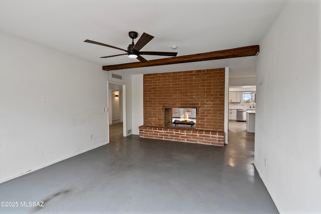 unfurnished living room with ceiling fan, a brick fireplace, and beam ceiling