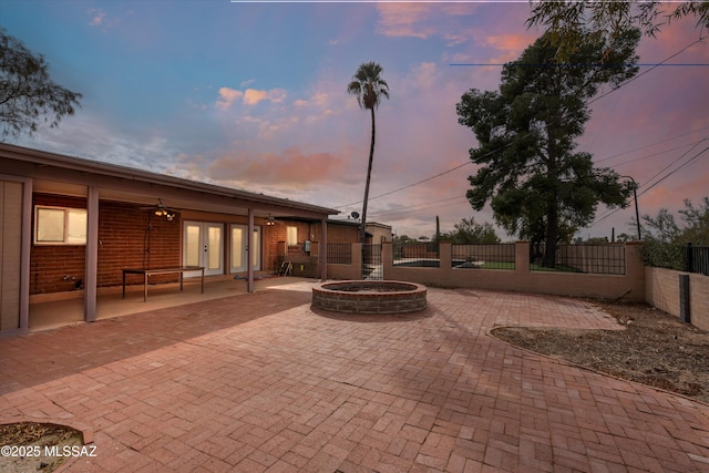 view of patio terrace at dusk