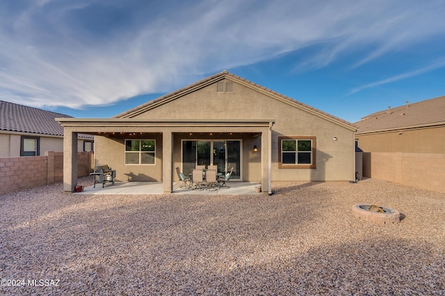 rear view of property featuring a patio area