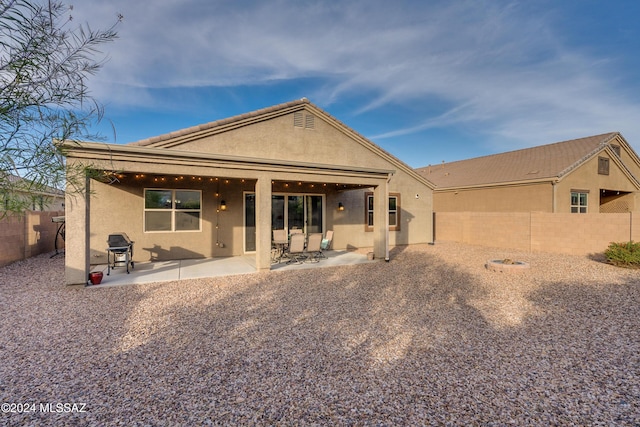 back of house with a patio area