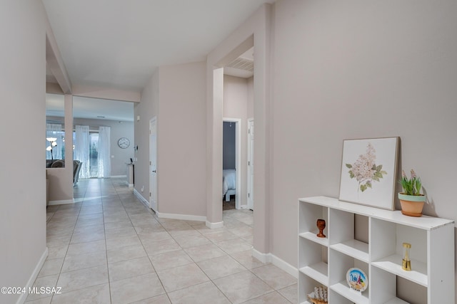 hallway with light tile patterned flooring