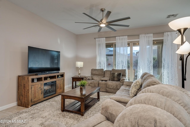 tiled living room featuring ceiling fan