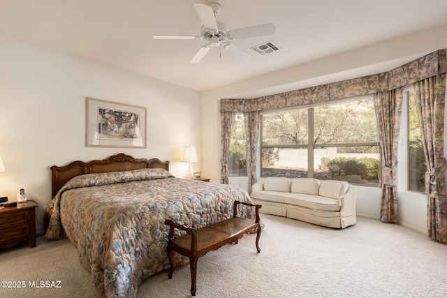 bedroom featuring a ceiling fan, visible vents, and carpet flooring