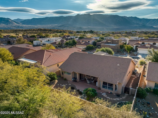 birds eye view of property with a mountain view